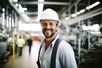 Man smiling factory hardhat. 