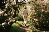Woman walking outdoors woodland. AI generated Image by rawpixel.