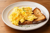 Sourdough toast scrambled eggs plate food. 