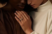 Two people hugging each other in a hug with engagement rings jewelry diamond finger. AI generated Image by rawpixel.