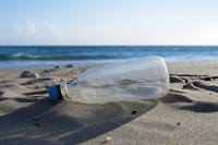Plastic bottle on the beach outdoors nature sea. AI generated Image by rawpixel.