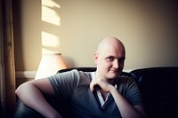 Cancer patient sitting portrait looking photo. AI generated Image by rawpixel.