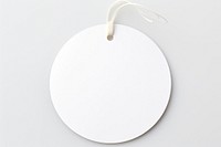 Price tag paper label circle shape photo white background photography. AI generated Image by rawpixel.