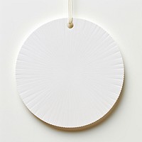 Price tag paper label circle shape pattern white background accessories. AI generated Image by rawpixel.