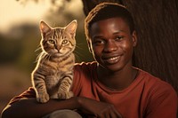 African man with cat pet portrait mammal. 