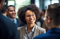 Young African woman sis standing and talking in business meeting smiling adult happy. AI generated Image by rawpixel.