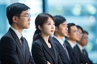 A group of Japanese businesspeople watching someone giving a presentation on a board adult togetherness cooperation. AI generated Image by rawpixel.