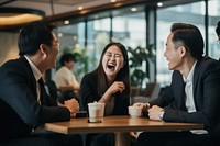 Eastern Asian business workers are laughing together conversation meeting adult. AI generated Image by rawpixel.