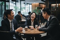 Eastern Asian business workers are laughing together meeting adult cup. AI generated Image by rawpixel.