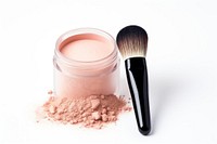 Foundation makeup powder brush with a jar cosmetics white background lipstick. 