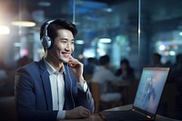 Korean man working at call center laptop headphones computer. AI generated Image by rawpixel.
