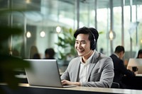 Korean man working at call center laptop headphones computer. AI generated Image by rawpixel.