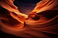 Starry night by the spire of antelope canyon backgrounds nature wave. AI generated Image by rawpixel.