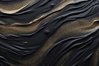 Black and gold sand texture with sparkling backgrounds nature textured. 