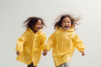 Girl in yellow raincoat child joy togetherness. 