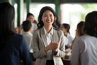 Middleage laotian businesswoman adult smile togetherness. AI generated Image by rawpixel.