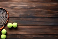 Tennis equipment border on wooden table sports racket ball. AI generated Image by rawpixel.