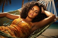 A Latina Colombian woman lying in a hammock near the beach summer adult tranquility. AI generated Image by rawpixel.