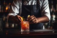 A bartender making a cocktail drink hand refreshment. 