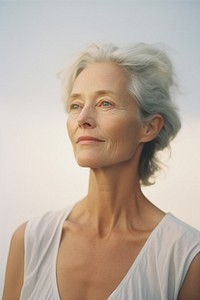 Expired film photography of mature woman portrait adult contemplation retirement. AI generated Image by rawpixel.
