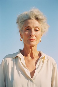 Expired film photography of mature woman portrait adult contemplation retirement. AI generated Image by rawpixel.