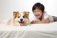 Happy asian kid dog portrait mammal. AI generated Image by rawpixel.
