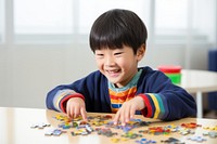 Happy korean kid puzzle child happiness. AI generated Image by rawpixel.