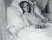 A convalescent girl, lying in bed, holding a bunch of flowers. Photograph by Ernest G. Boon, ca. 1904.