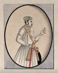 A Mughal courtier holding a sword and an ornament. Watercolour drawing by an Indian artist.