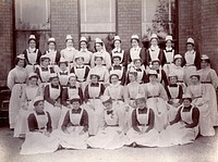 Claybury Asylum, Woodford, Essex: thirty-four nurses. Photograph by the London & County Photographic Co., [1893].