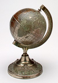 bronze colored globe on pedestal; globe rotates on axis; raised design on pedestal. Original from the Minneapolis Institute of Art.