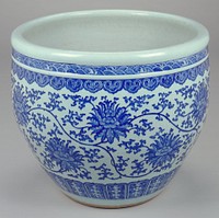 large blue and white porcelain jardiniere; two small bands at rim top being a wave pattern; large band at body of flowers joined by wandering vines; small band at foot. Original from the Minneapolis Institute of Art.