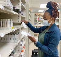 Naval Hospital Jacksonville pharmacy 220107-N-QA097-396JACKSONVILLE, Fla. (Jan. 7, 2022) - Wyconda Abram, a pharmacy technician at Naval Hospital Jacksonville, pulls medicine to fill prescriptions. Abrams, a native of Moss Point, Mississippi, says, “Our team makes sure prescription types and amounts are correct, so patients can get better.” (U.S. Navy photo by Deidre Smith, Naval Hospital Jacksonville/Released).