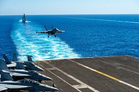 MEDITERRANEAN SEA. An F/A-18E Super Hornet, attached to the "Wildcats" of Strike Fighter Squadron (VFA) 131, lands on the flight deck of the Nimitz-class aircraft carrier USS Dwight D. Eisenhower (CVN 69), as the Italian Horizon-class destroyer ITS Andrea Doria (D 553) sails in formation with Ike in the Mediterranean Sea. Original public domain image from Flickr