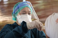 Medical staff helping a patient. Original public domain image from Flickr