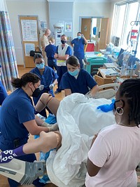 Revived Mannequins Breathe New Life Into Training 220426-D-NI099-048Lt. Cmdr. Kristen Elmezzi responds to Code Purple Drill simulating birth with shoulder dystocia, also called birth trauma with “Victoria,” a Simulation Mannequin used during training at US NMRTC Guantanamo Bay