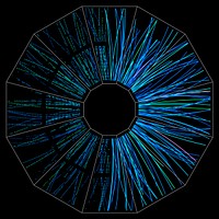 End view of a low-energy collision event at the STAR detector at the Relativistic Heavy Ion Collider (RHIC) shows particle tracks on the right and detector "hits" from which tracks are derived on the left. 