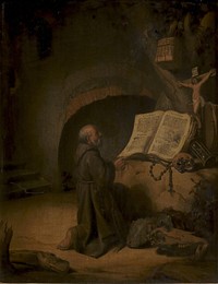 A hermit in prayer by Rembrandt van Rijn