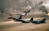 USAF aircraft of the 4th Fighter Wing (F-16, F-15C and F-15E) fly over Kuwaiti oil fires, set by the retreating Iraqi army during Operation Desert Storm in 1991. Almost the same as Image:USAF F-16A F-15C F-15E Desert Storm pic.jpg save for the size and tint