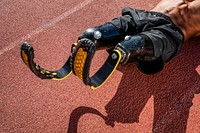 Male athlete with prosthetic legs crunching