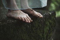 Free woman feet stand of rock image, public domain people CC0 photo.