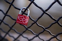 Free love lock on fence public domain CC0 photo.