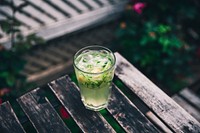 Free cucumber cocktail on wooden table photo, public domain beverage CC0 image.