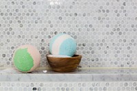 Free two bath bombs and wooden bowl of Epsom salt in spa bathroom photo, public domain CC0 image.