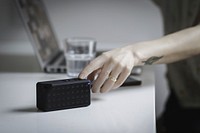 Free woman changing song on bluetooth speaker image, public domain CC0 photo.