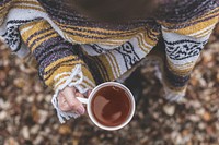 Free hand holding a cup of coffee photo, public domain drink CC0 image.