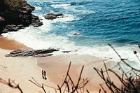 Free couple on the private beach aerial view public domain CC0 photo.