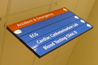 Direction sign in hospital. Original public domain image from Flickr