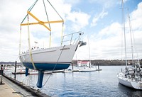 Lifting boat on a pier. Original public domain image from Flickr