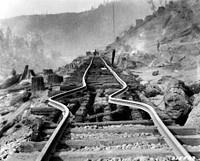 Rails Buckled after Trestle Fire, Pe Ell, WA 1926. Original public domain image from Flickr